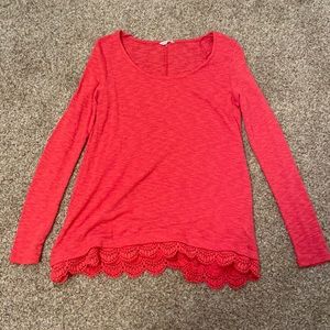 raspberry red long sleeve with detailing on bottom